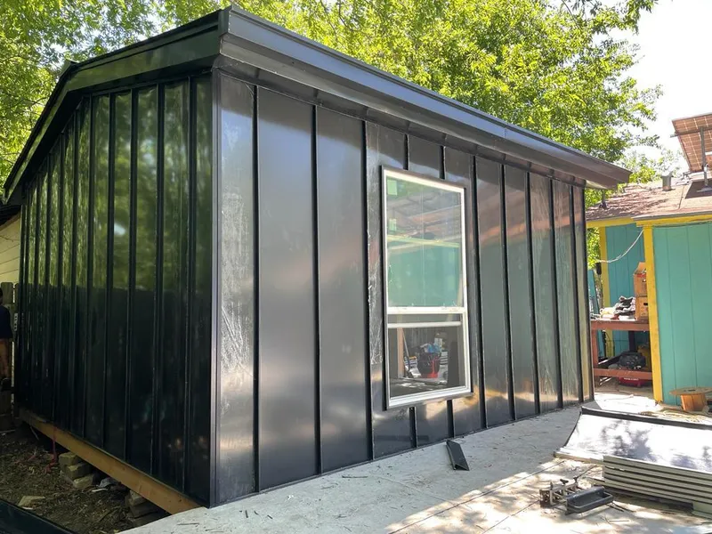 Black standing seam metal wall panels for Metal Roof Installation in Two Rivers